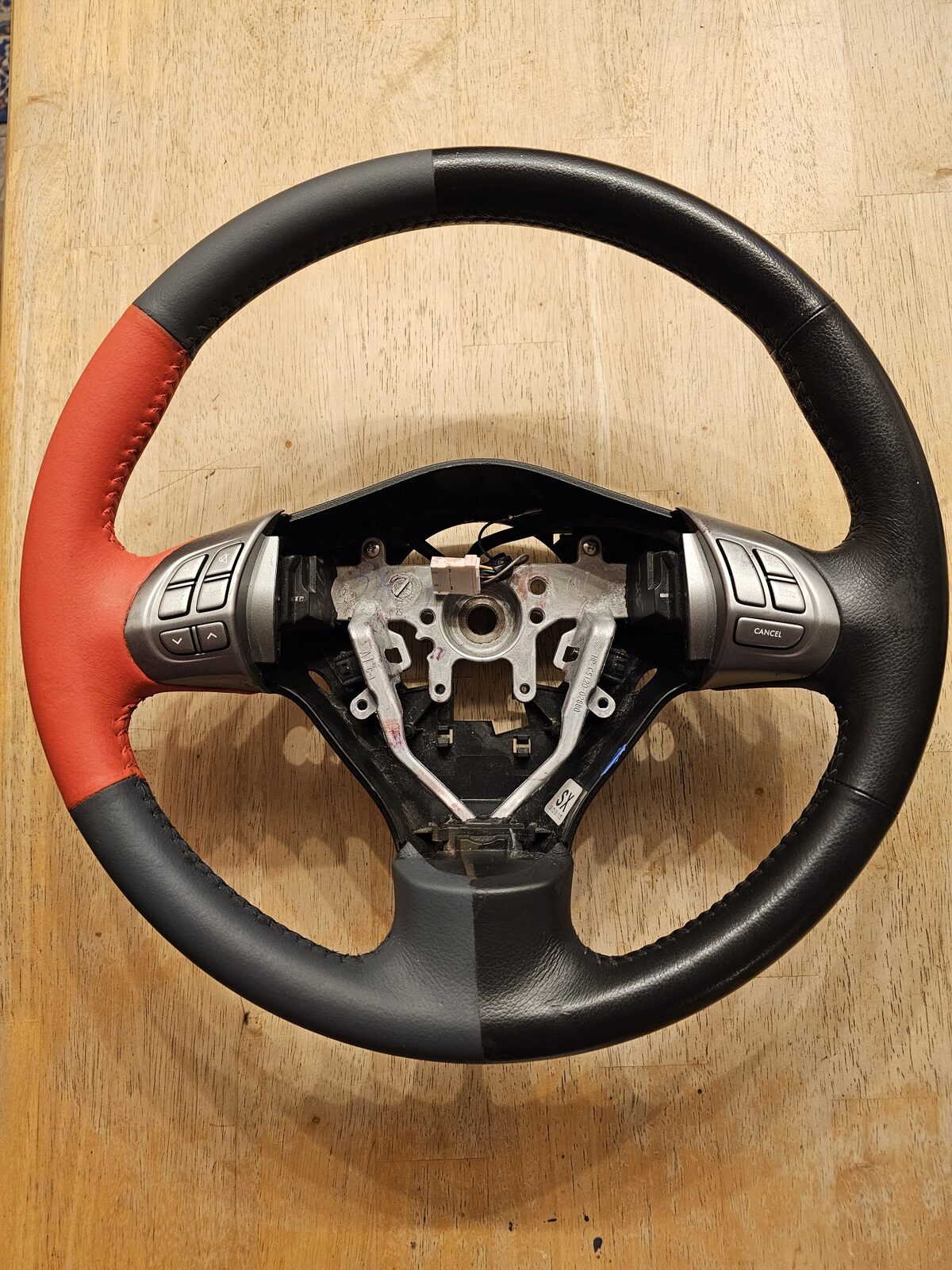 Custom two-tone leather steering wheel restoration