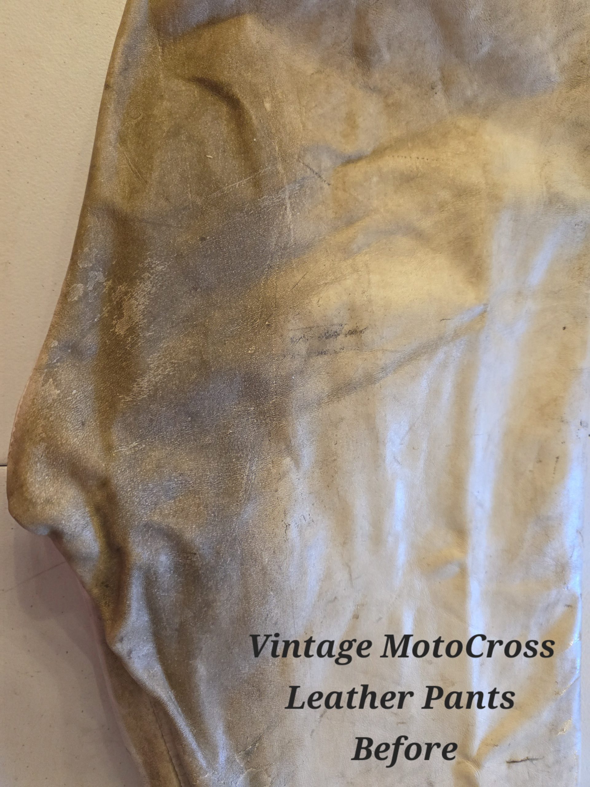 Vintage motocross leather pants before cleaning