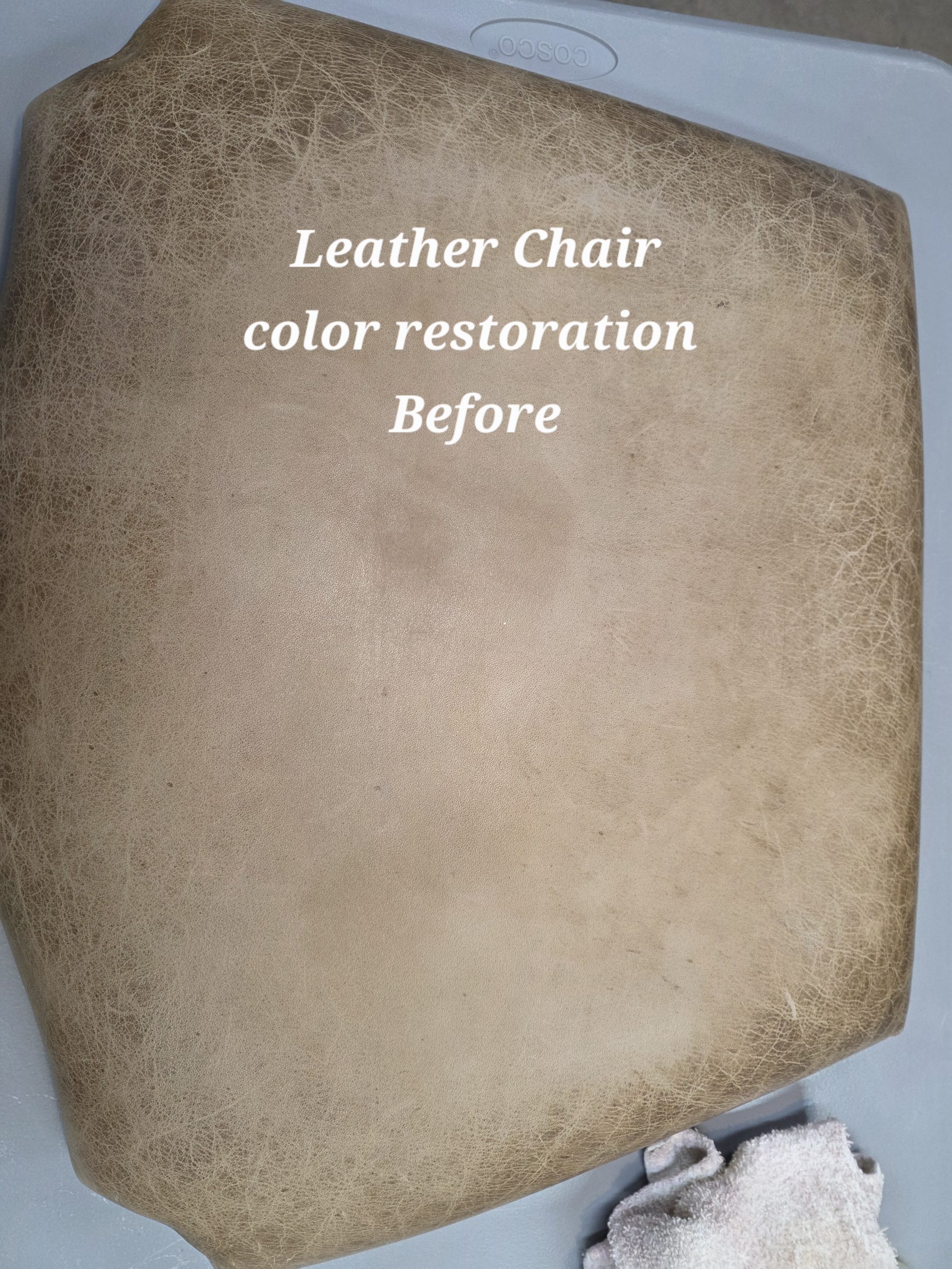 Worn leather armchair before color restoration