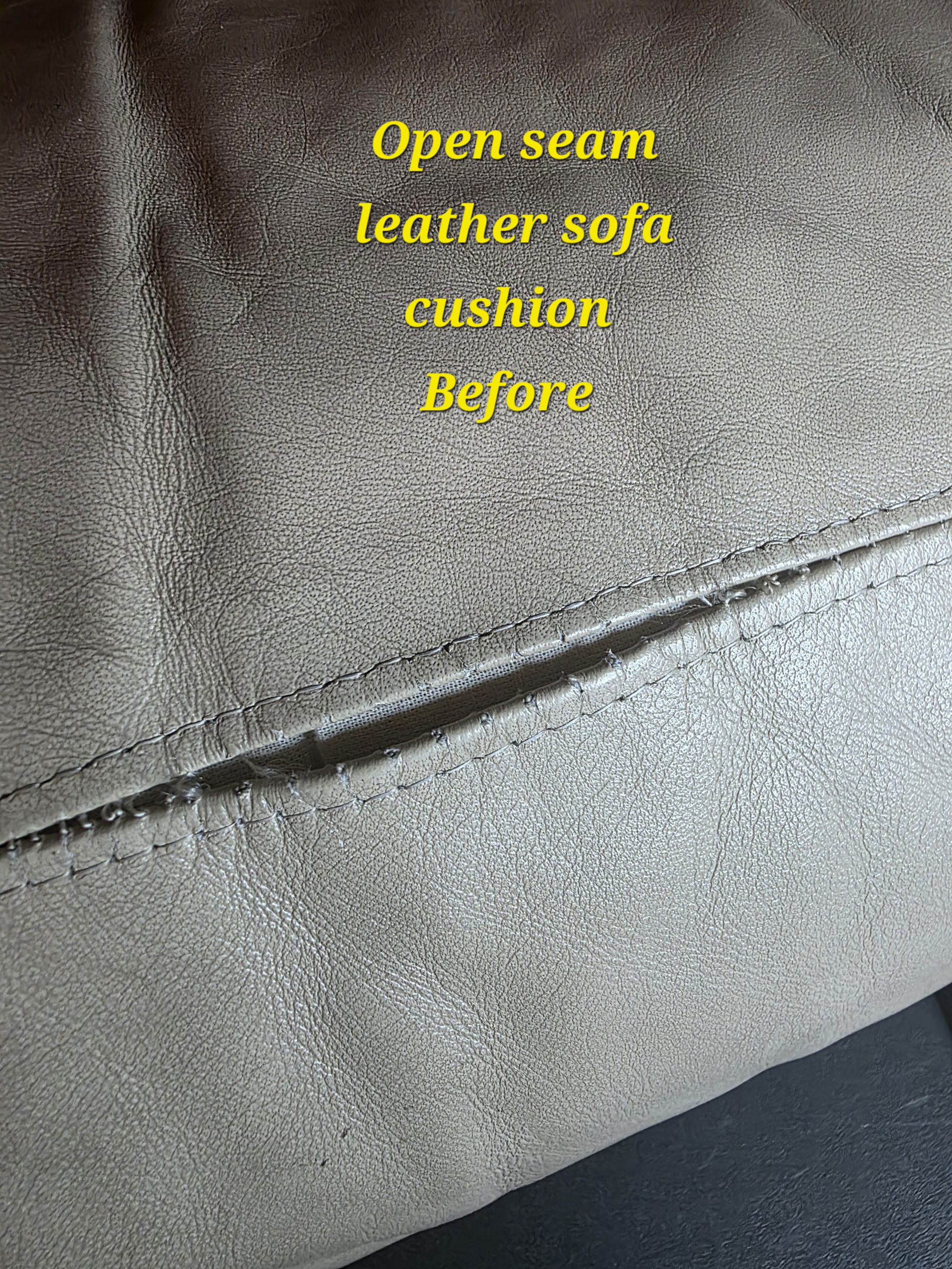 Sofa cushion with open leather seam before repair